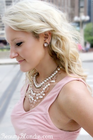 I love the accessories with this light pick dress, the simple studs and a bold necklace