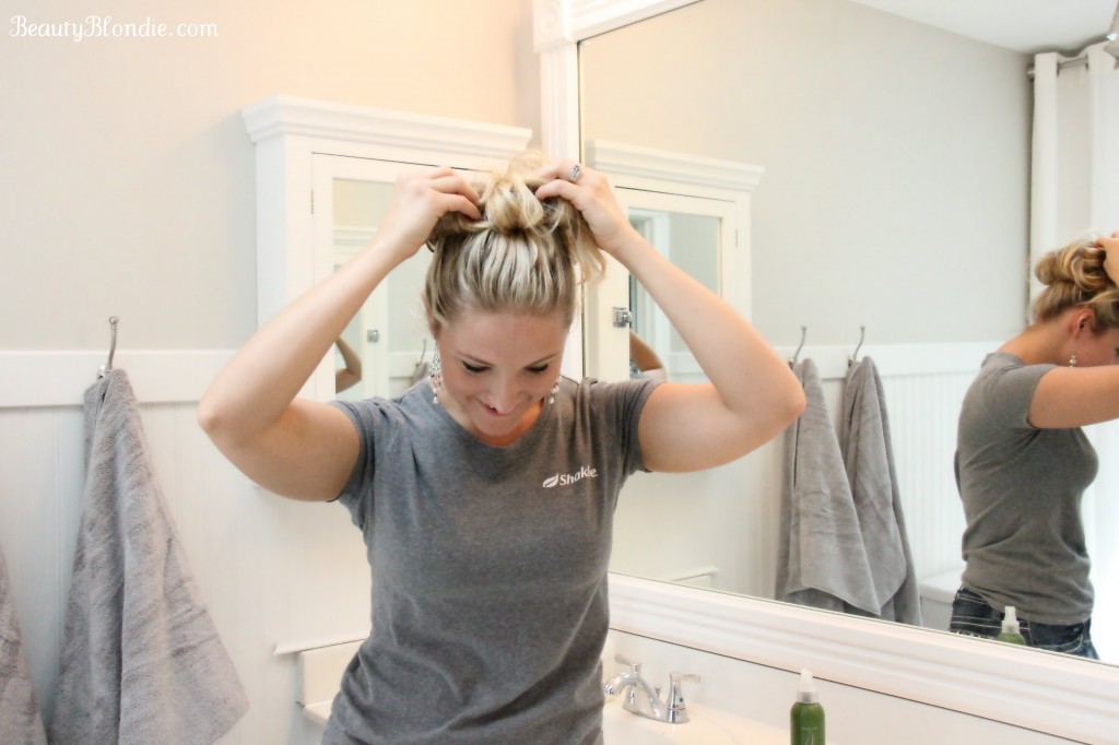 10 Grab hair from both sides of the bun and pull to loosen the bun.